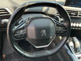 the interior of a car with a steering wheel and dashboard controls