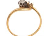 a close up of a gold ring with a crown on top of it