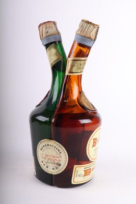 two bottles of liquor sitting next to each other on a table