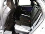 the back seats of a car with a seat belt in the back of it