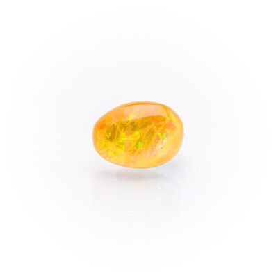 a yellow oplite gems on a white background