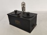 a black box with a light on top of it sitting on a table