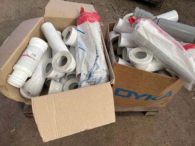 a box full of toilet paper rolls and other items in it