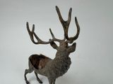 statue of a stag with antlers on a white background