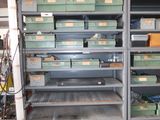 many boxes and bins on the shelves in the room