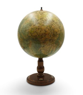 an old globe on a wooden stand on a white background