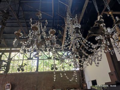 a large chandelier hanging from the ceiling in a building