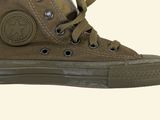 a picture of a pair of brown sneakers on a white background