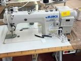 a sewing machine that is sitting on a table