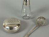 a salt and pepper shaker next to a salt shaker