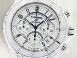 a white watch with a white face and black hands