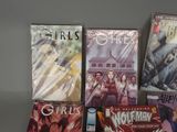 a lot of comic books on the table
