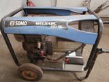 a small generator that is sitting in the garage