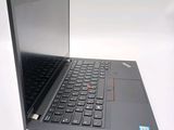 a laptop with a black keyboard on a white surface
