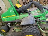 a lawn mower that is sitting on the ground