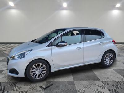 a white car is parked in a room with a checkered floor