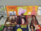 a lot of music books that are on the table