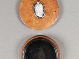 a small wooden box with a picture of a woman on it