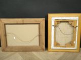 pair of antique wooden picture frames with glass inserts