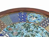 a picture of a decorative plate with a bird on it