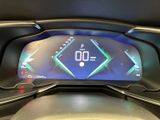 the dashboard of a car with a digital display on it