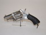 an old revolver that is on display on a table