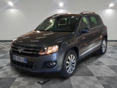 the volkswagen tiguan is parked on a checkered floor in a garage