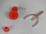 a pair of pliers, a pair of scissors, and a ball of yarn