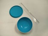 two bowls and a ruler on a table