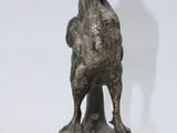 statue of a goat on a marble base with a shadow on a white background