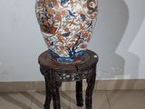 a vase that is sitting on top of a stool