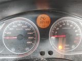 a close up of a car dashboard with a speedometer and gauges