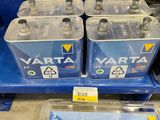 four varta batteries are sitting on a shelf in a store