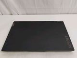 an open laptop computer sitting on top of a white surface