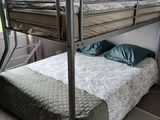 a bunk bed with a metal frame in a room