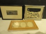 two framed pictures on the table next to each other