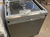 a metal box with a fan inside of it in a warehouse