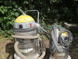 two vacuums that are sitting on the ground next to each other