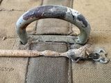 a piece of fabric with a metal handle on it