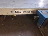 a picture of a metal bench with a sign on it