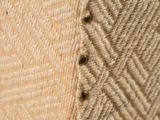 close up of a piece of fabric with holes in it