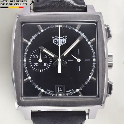 a close up of a watch with a black face