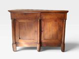 an old wooden cabinet with two doors and two drawers