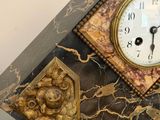 a clock that is sitting on top of a glass table