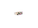a close up of a ring with multi colored stones on it
