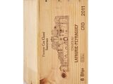 the wooden box is holding a bottle of wine and a bottle opener