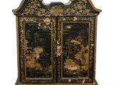 a black and gold cabinet with two doors on it