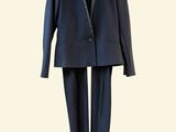 an image of a suit hanging on a hanger