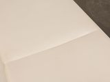 a piece of paper on a table with a knife and fork