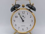 a small clock that is sitting on a table
